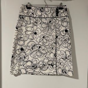 White Skirt with black flowers.